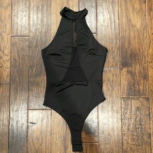 Fashion nova mesh body suit . Black with mesh down the center.